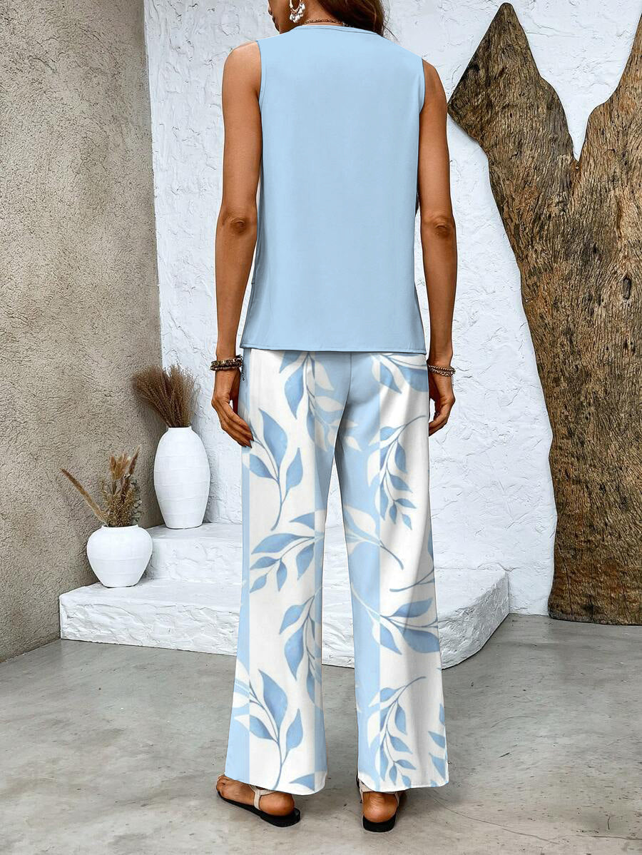 Back view of light blue sleeveless top with blue leaf print wide-leg pants