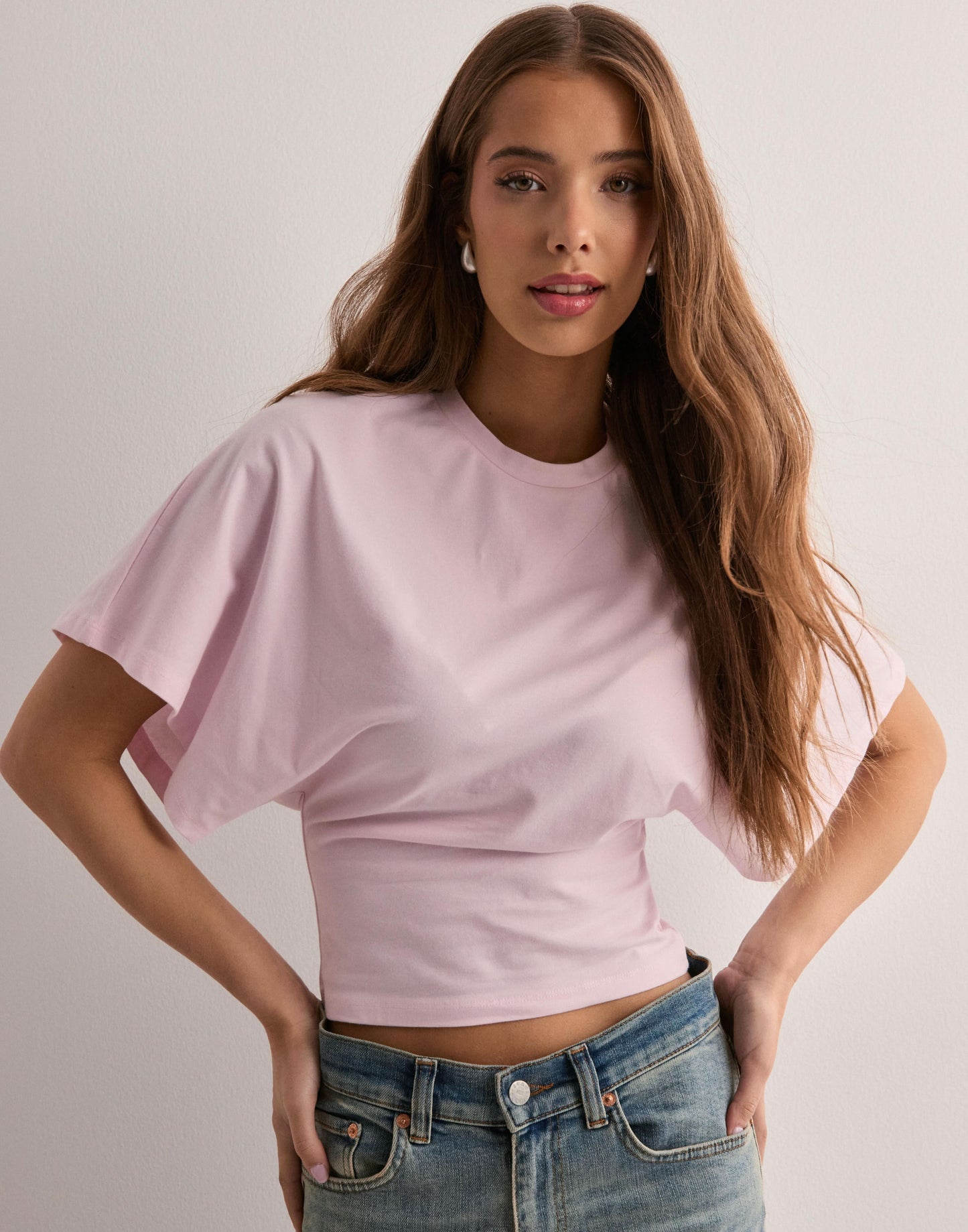 Soft pink batwing crop top with short flutter sleeves, front view