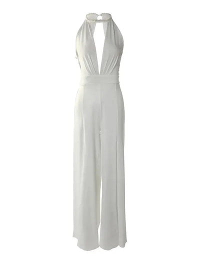 Full length flat lay of ivory backless jumpsuit with halter closure and wide pants