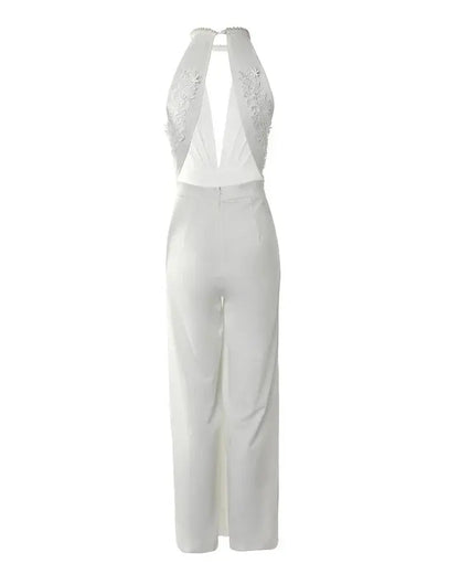 Back view flat lay of white backless jumpsuit showing lace embroidered back panel