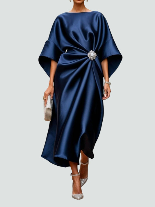 Navy satin midi dress with draped bodice and crystal brooch embellishment