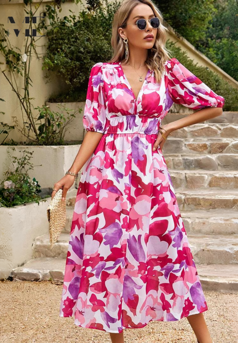 Pink and magenta floral midi dress with puffed sleeves and cinched waistband