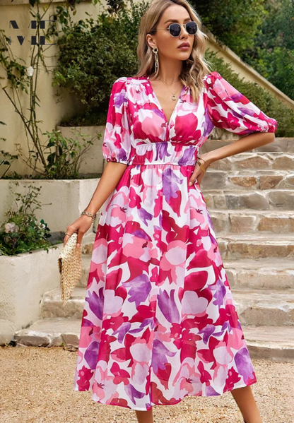 Pink and magenta floral midi dress with puffed sleeves and cinched waistband