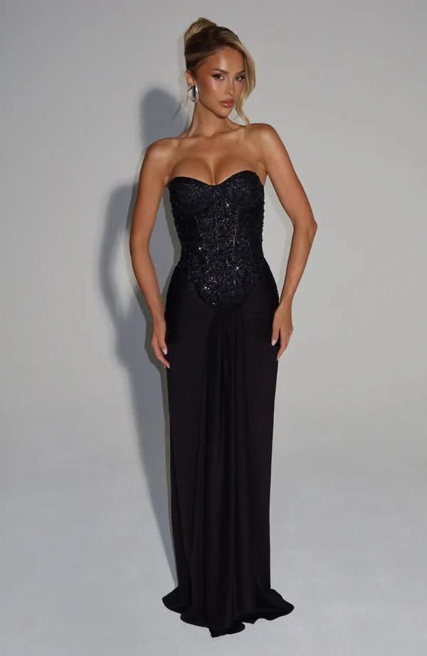 Black sequin maxi dress with sweetheart neckline and flowing skirt