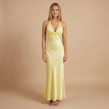 Pale yellow halter maxi dress with twisted front detail and deep V-neckline