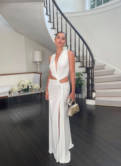 White cutout maxi dress with deep v-neck and twisted waist openings