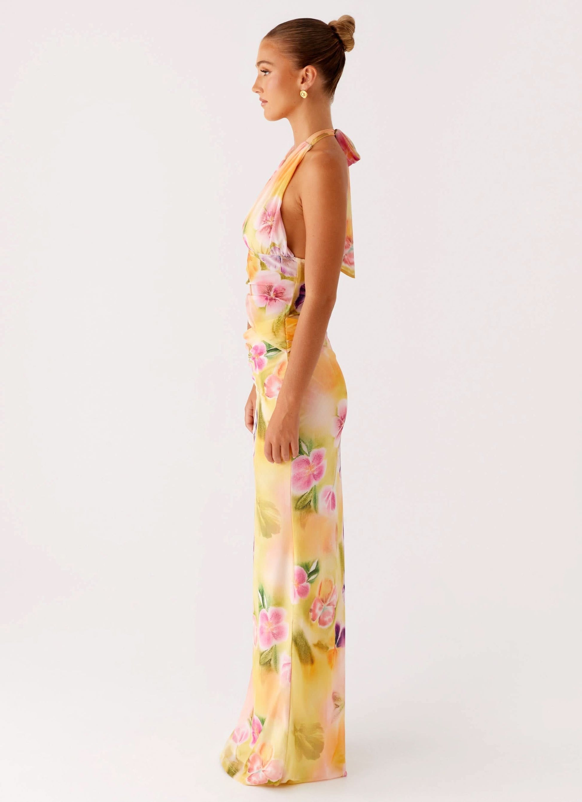 Side profile of floral wrap midi dress with draped fabric