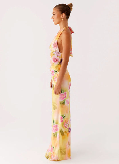 Side profile of floral wrap midi dress with draped fabric