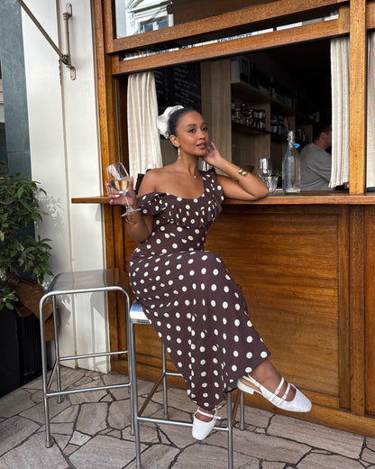 Brown polka dot maxi dress with off-shoulder ruffle sleeves and fitted bodice