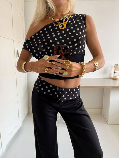 Black polka dot crop top with ribbed waistband and white dot pattern
