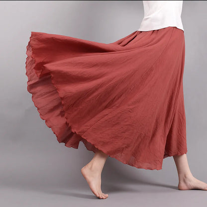 Burgundy pleated maxi skirt close-up of ruffled hem and flowing linen texture