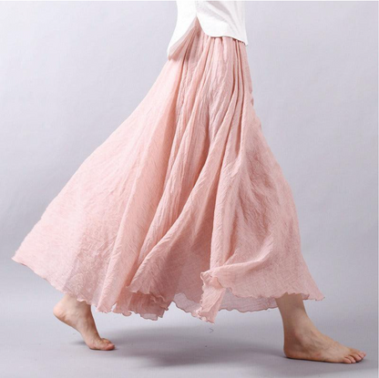 Blush pink pleated maxi skirt with soft romantic pleating