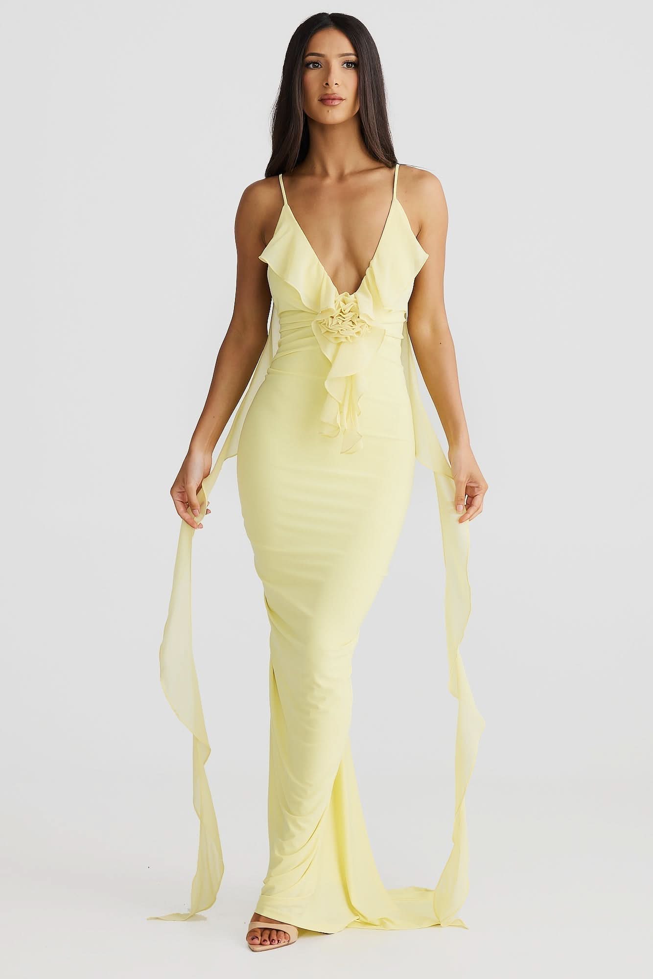 Pale yellow wrap maxi dress with ruffled V-neckline and tie waist detail