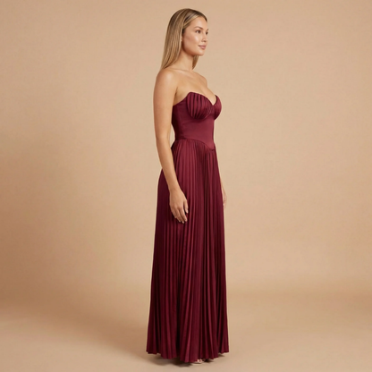Burgundy strapless sweetheart maxi dress with vertical pleating and formal silhouette for women