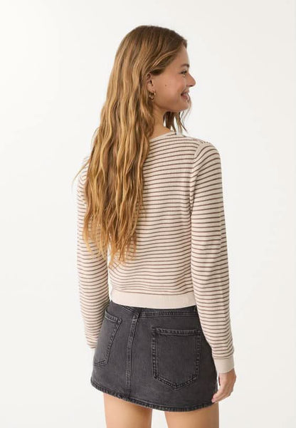 Charcoal gray denim mini skort styled with striped knit sweater