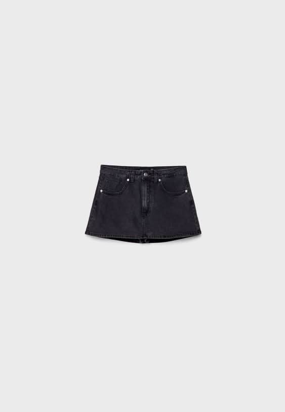 Black denim mini skort flat lay front view with metal hardware details