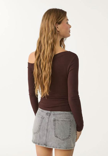 Gray denim mini skort back view showing pocket placement and seaming