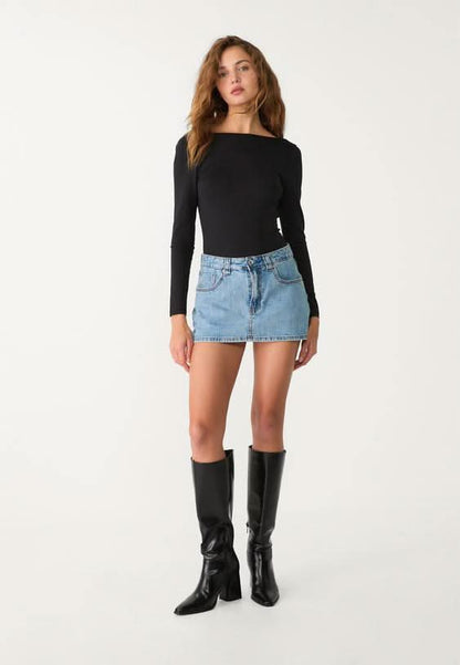 Light blue denim mini skort with five-pocket styling and frayed hem