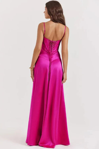 Magenta corset maxi dress outdoor shot showing draped skirt and structured bodice