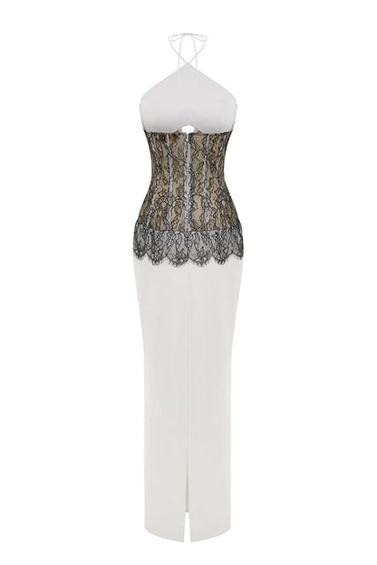 Back view of lace maxi dress showing black lace panel and center slit