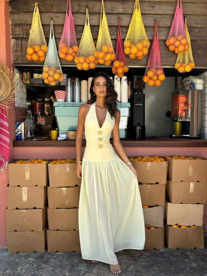 Cream halter maxi dress with gold starfish embellishments and flowing skirt