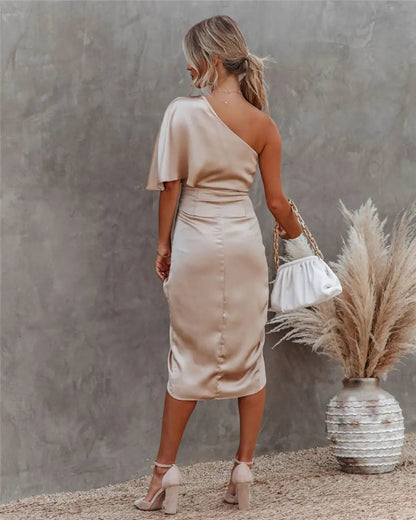 Back view of beige draped midi dress with flutter sleeve and fitted waist