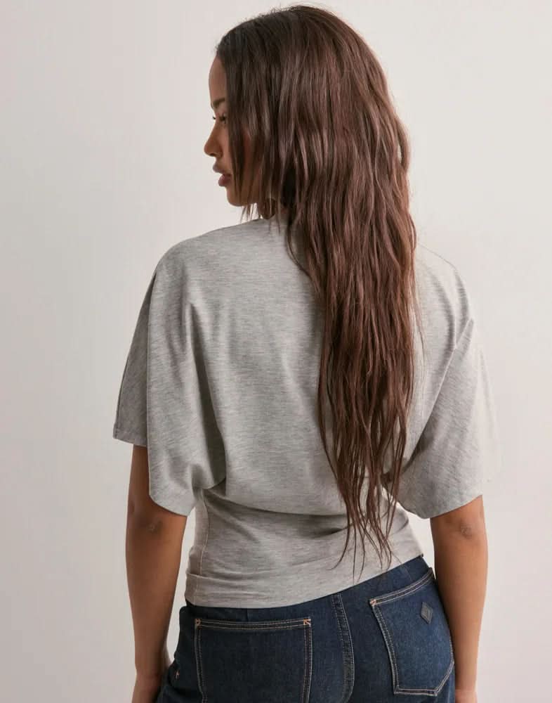 White batwing crop top with relaxed short sleeves, front view