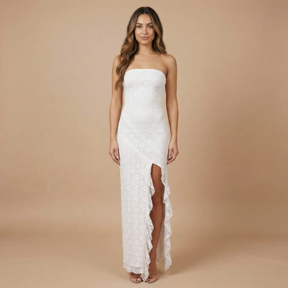 White lace strapless maxi dress with asymmetrical ruffle hem and slit
