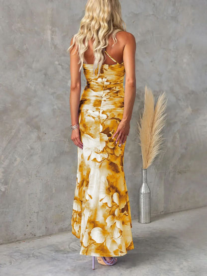 Back view golden yellow floral ruched maxi dress flowing hem