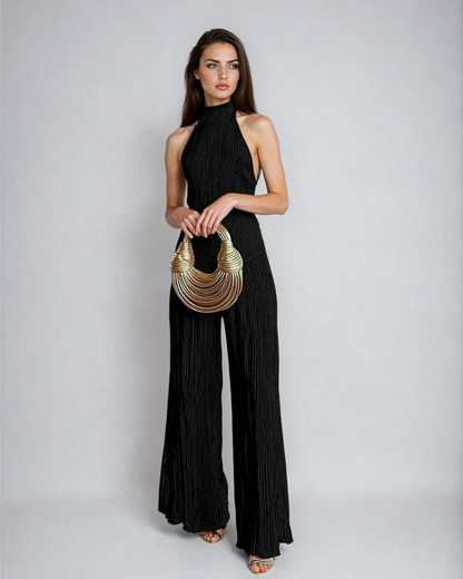 Black pleated halter neck pants set with sleeveless open back top and full-length wide legs