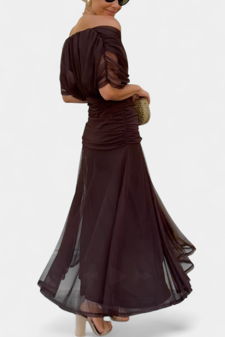 Back view of brown ruched maxi dress with flowing skirt