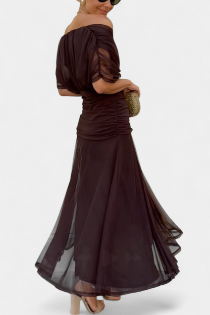 Back view of brown ruched maxi dress with flowing skirt