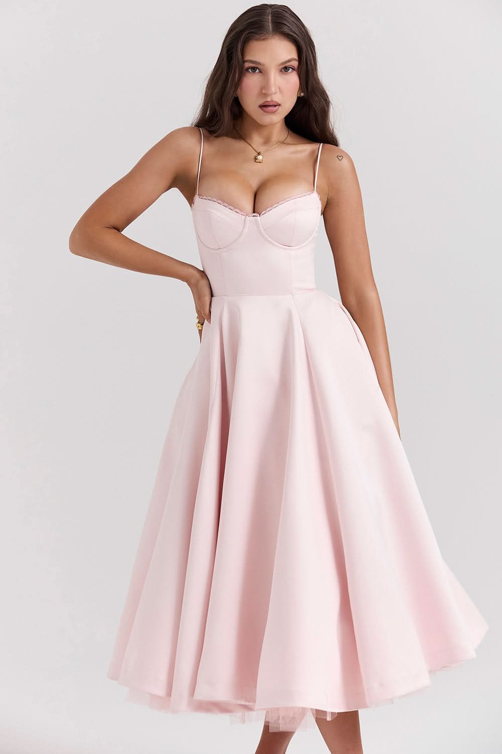 Light pink corset midi dress with thin straps and layered tulle hem