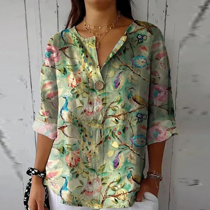 Vibrant lime and pink floral 3/4 sleeve top with bold watercolor flower design