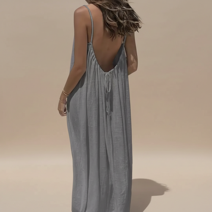 Back view of sage green maxi dress showing low V-back with drawstring and flowing fabric