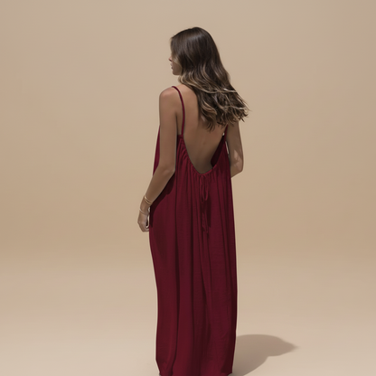 Deep burgundy maxi dress with ruched fabric and low open back view