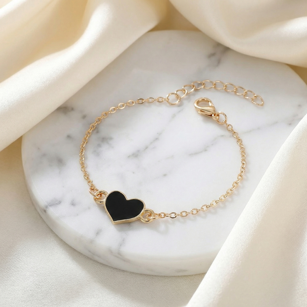 Gold heart charm chain bracelet with black enamel heart and adjustable extender for women