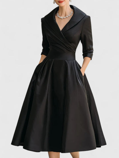 Black wrap midi dress with three-quarter sleeves and full skirt