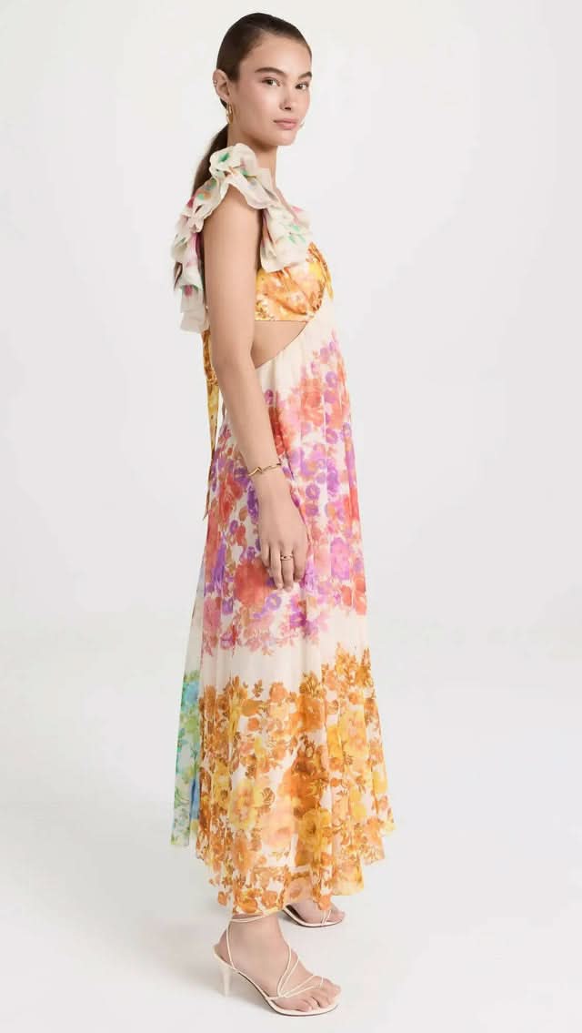 Side view of cream watercolor floral maxi dress with cutout details for women