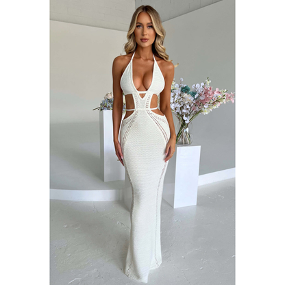White knit maxi dress with deep V-neckline and waist cutouts