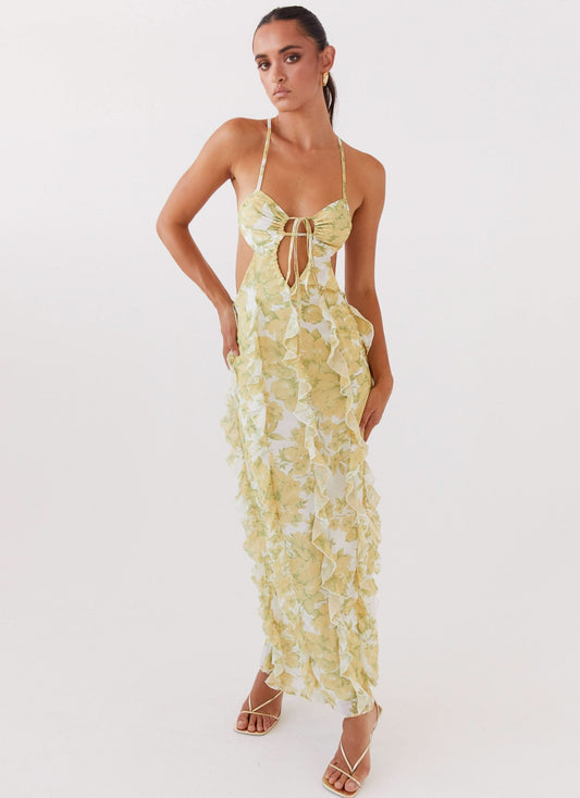 Pale yellow floral halter maxi dress with front tie cutout and ruffle texture for women