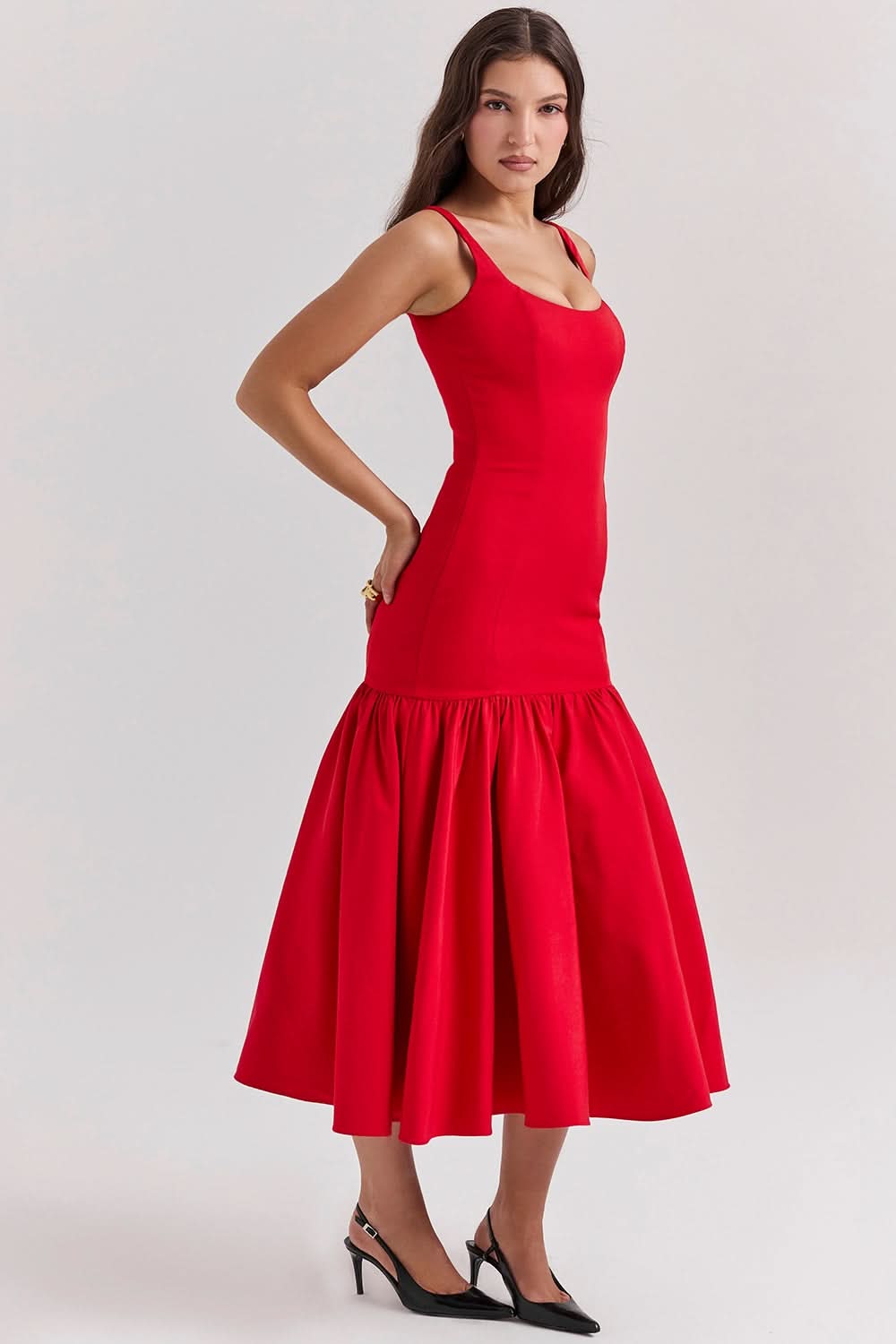 Red sleeveless ruffle midi dress side profile with dramatic gathered skirt