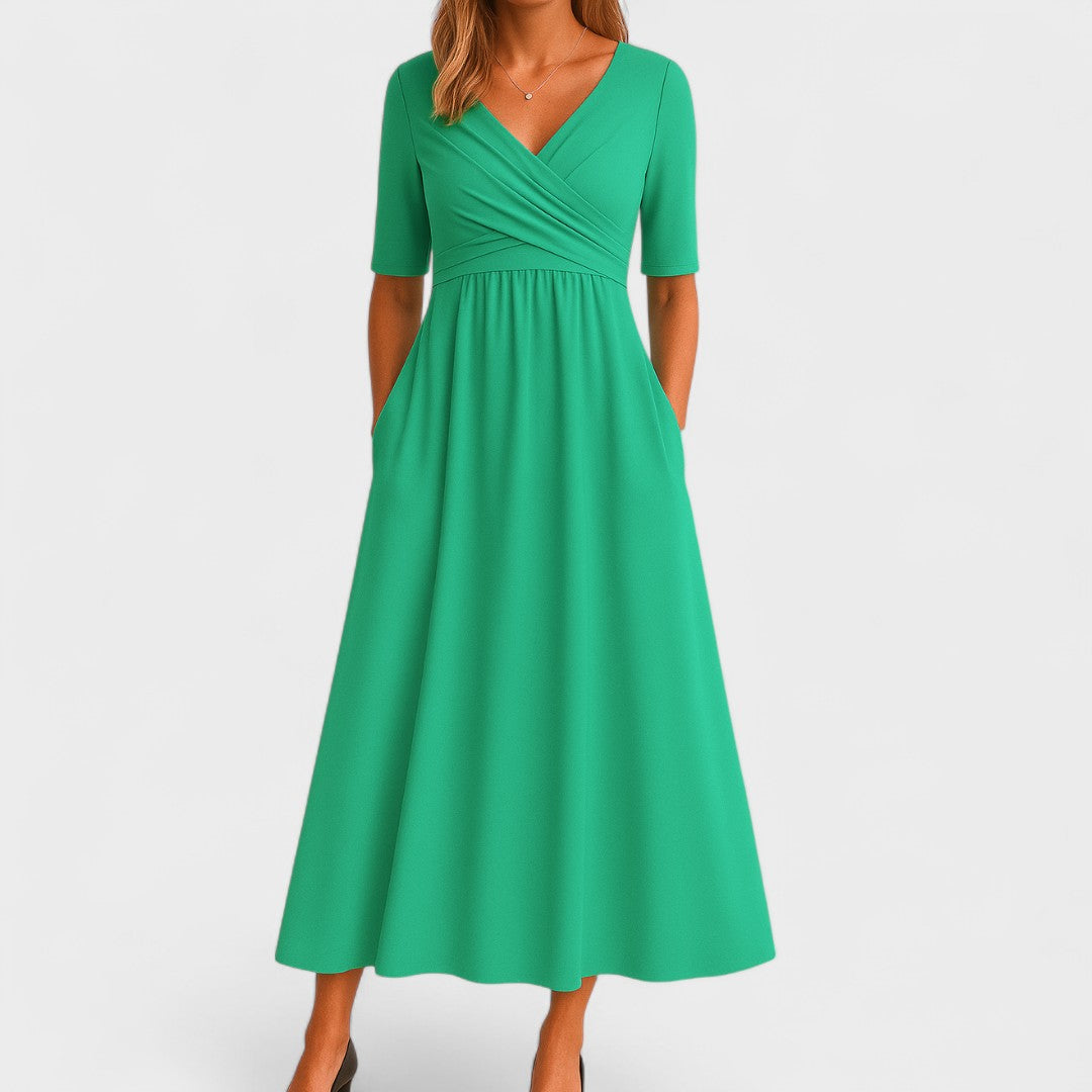Emerald green wrap midi dress with half sleeves and flowing skirt