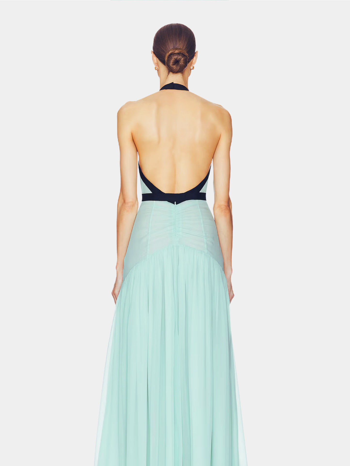 Back view of mint maxi dress showing open backless design