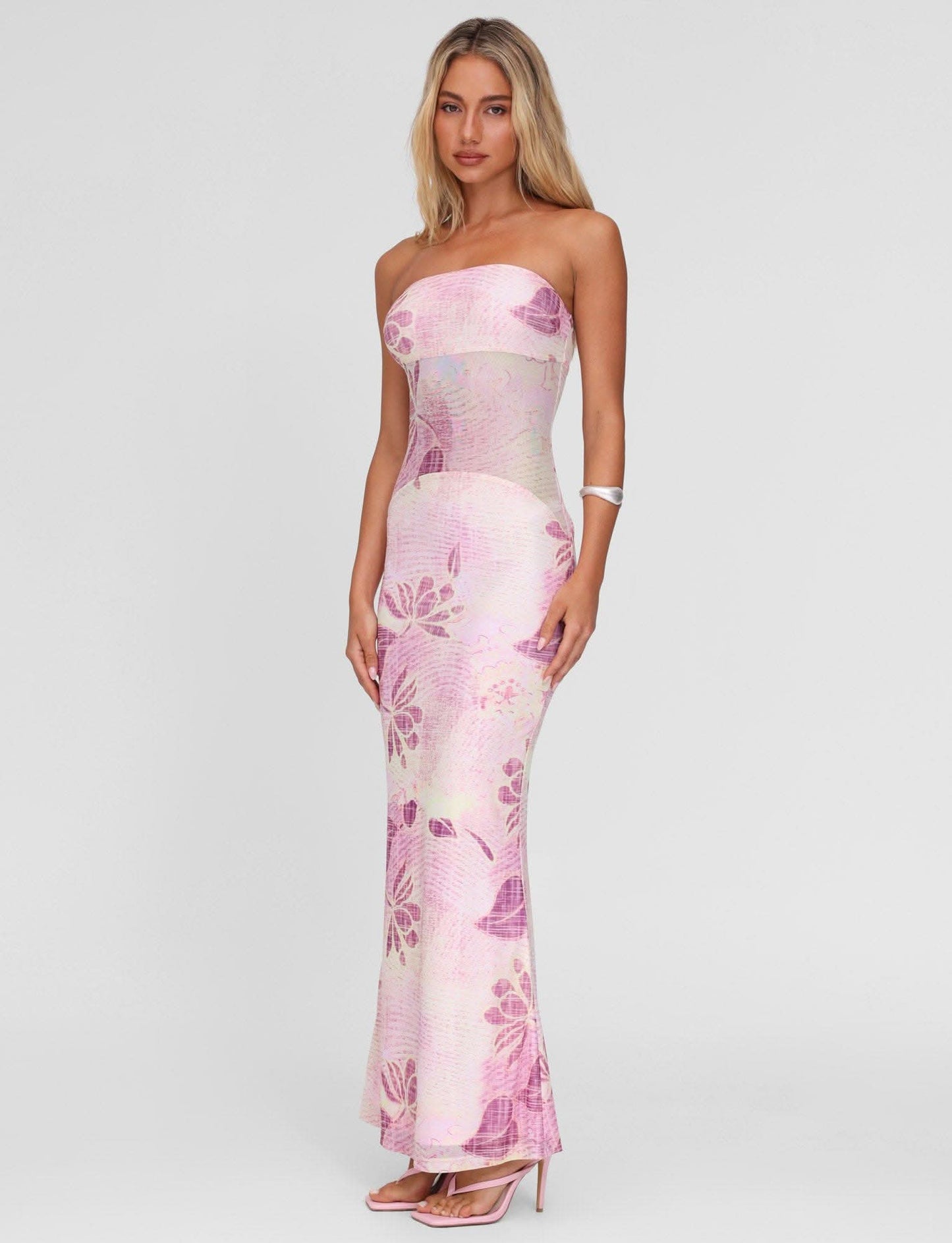 Strapless pink maxi dress with purple floral pattern and sheer waist detail