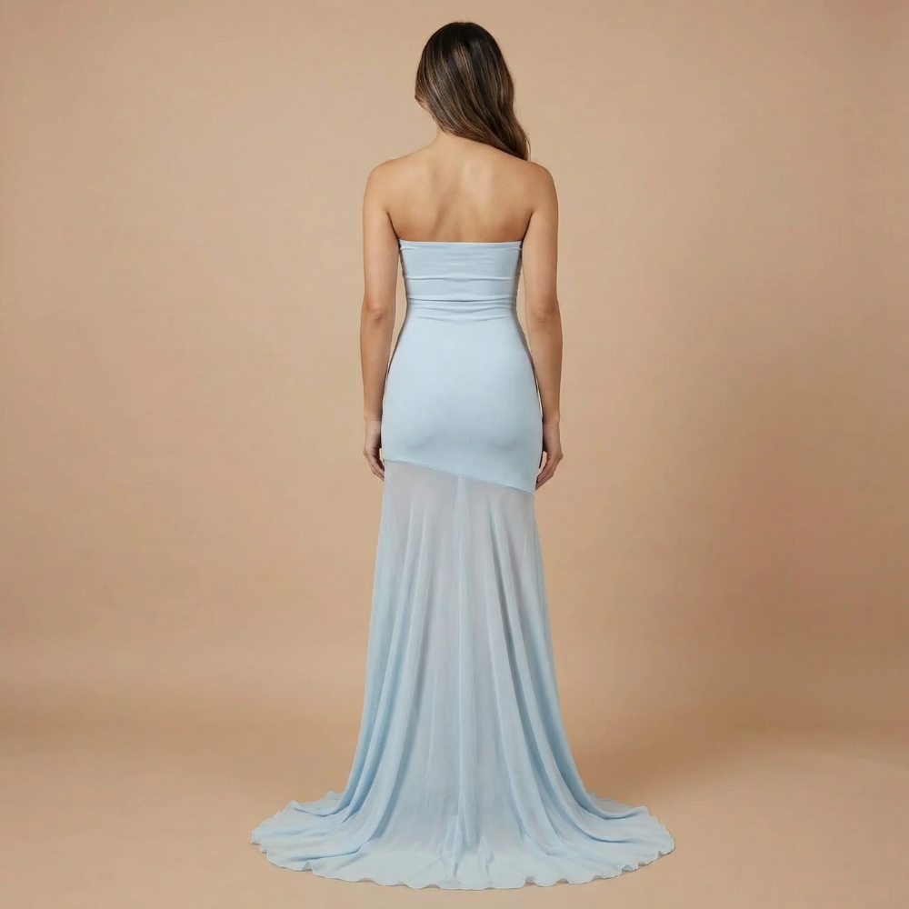Back view of light blue strapless maxi dress with mesh train