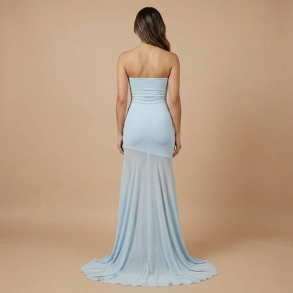 Back view of light blue strapless maxi dress with mesh train