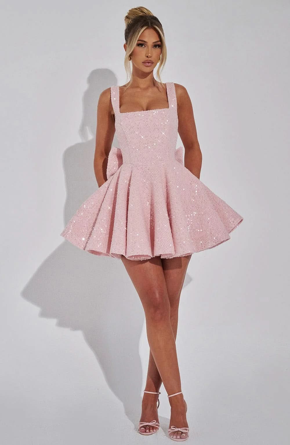 Blush pink sequin mini dress full length front view with full skirt