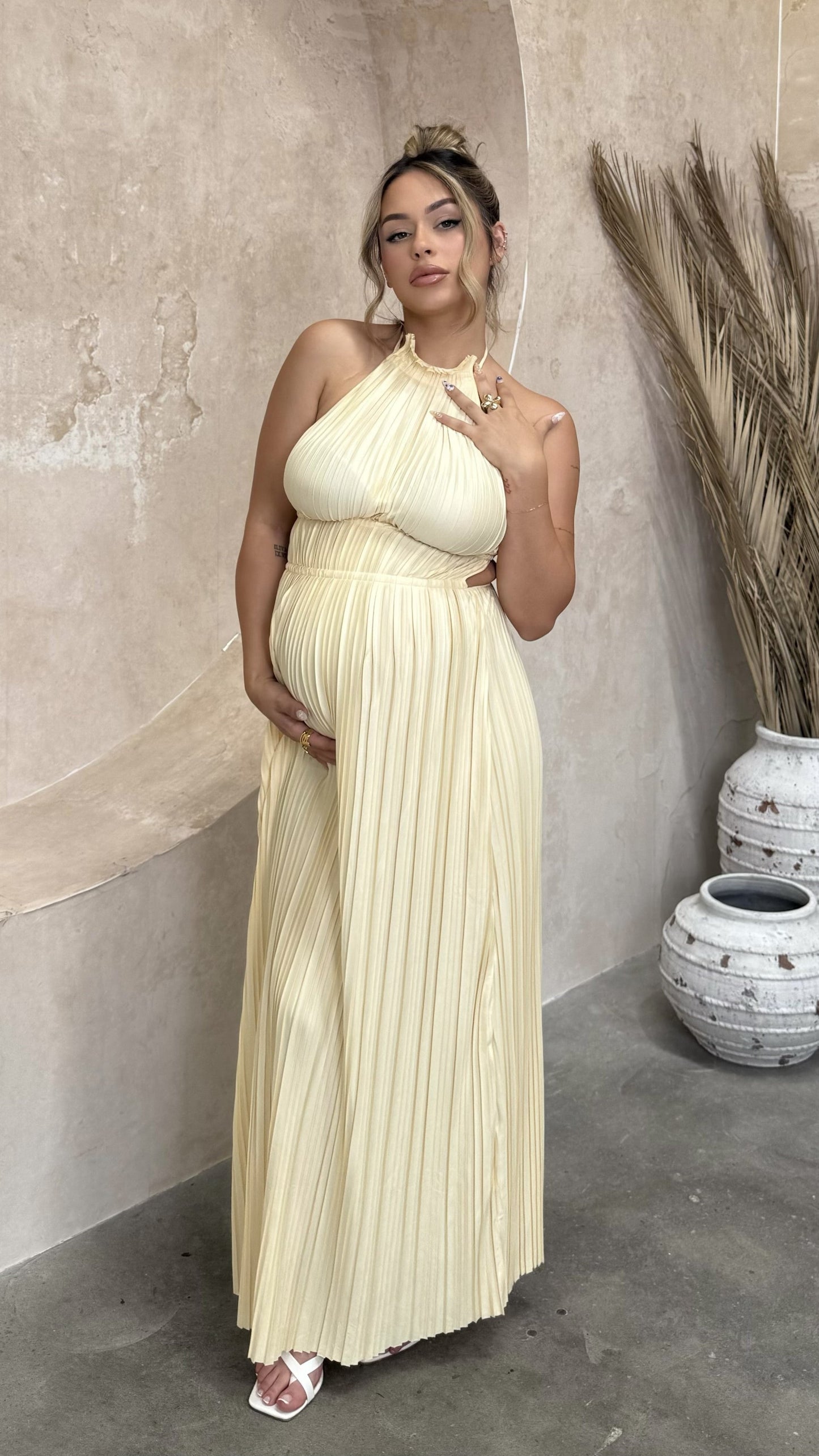 Cream pleated maxi dress with halter neckline and gathered bodice detail