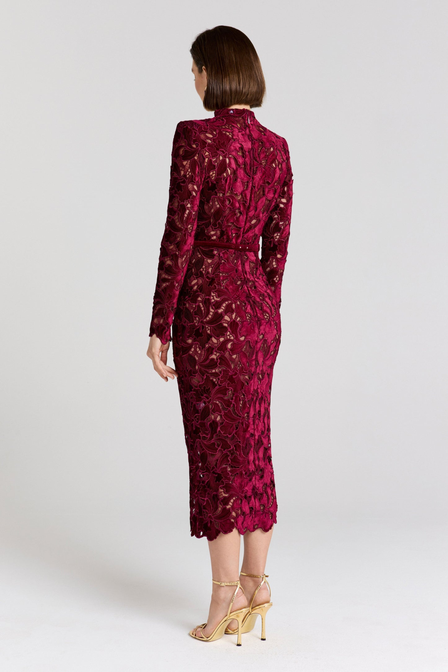 Back view of burgundy lace midi dress showing fitted waist belt detail